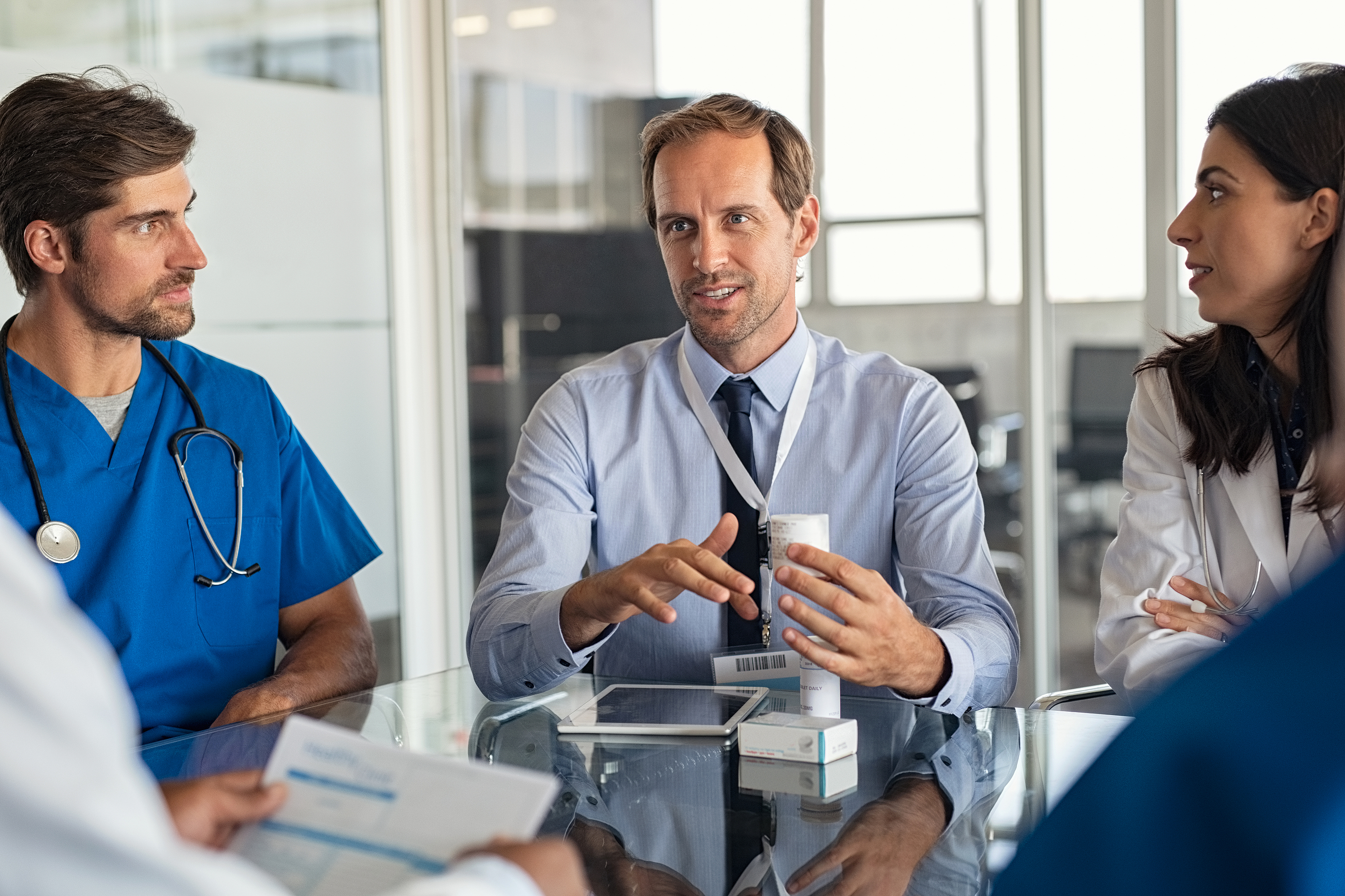 Conceptual image of NHS doctors collaborating to understand key Trust and departmental priorities, illustrating insight-driven consultant interview preparation.