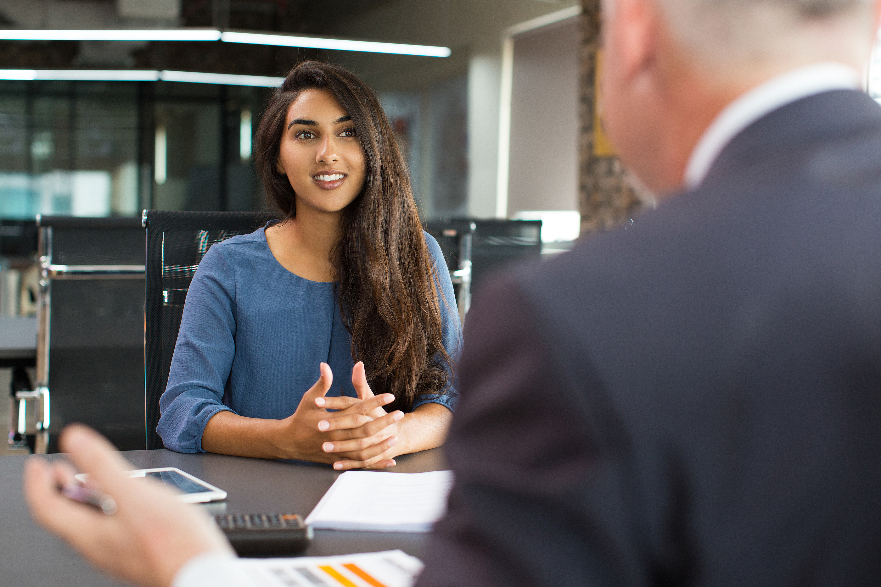 Conceptual image of a panel discussion, representing a junior doctor strategically preparing for pre-interview visits and panel interactions for consultant roles.